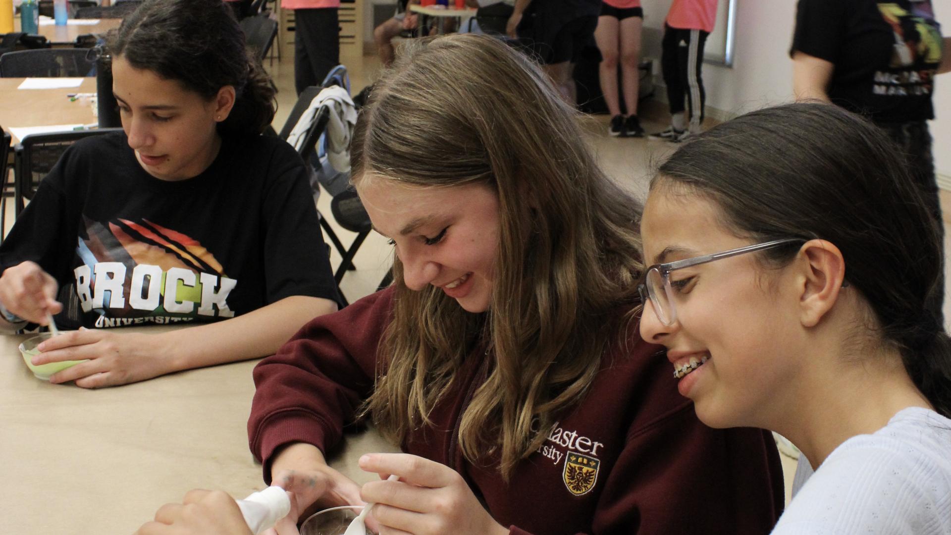 students in a classroom working on a science project
